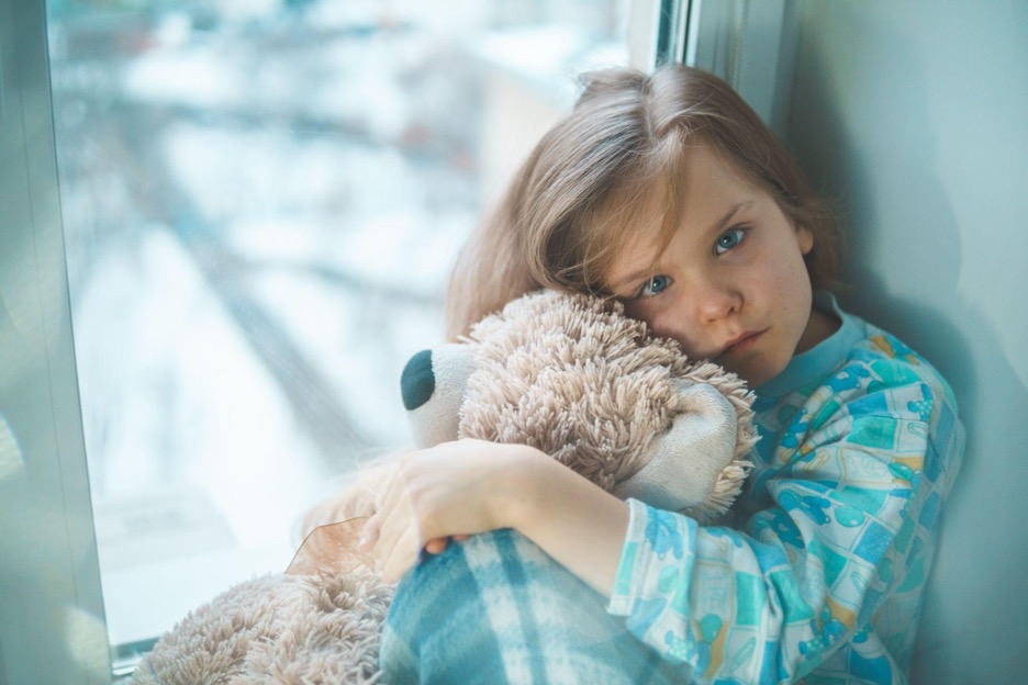 Young Girl Holding Teddy Bear